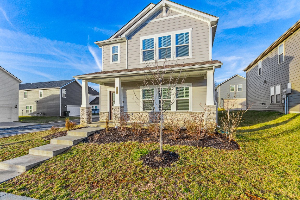 a front view of a house with a yard