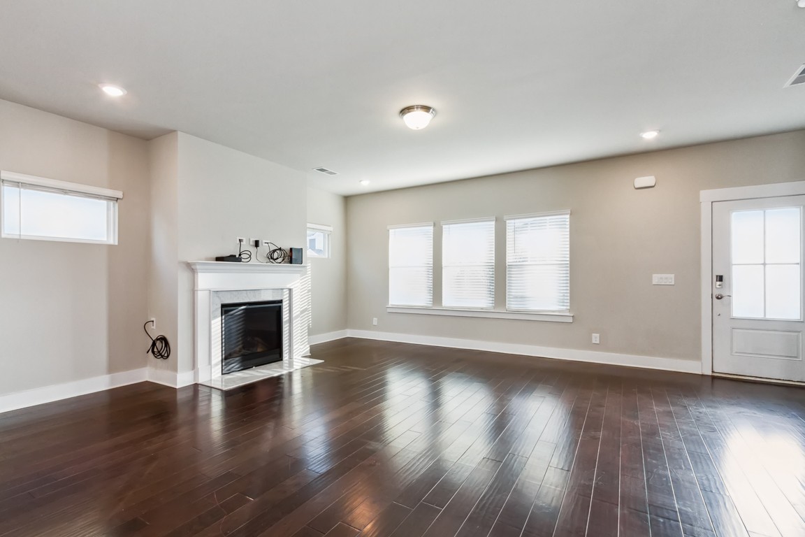 3261 Longstalk Road Antioch, TN 37013 - Photo 11 of 46 a view of empty room with wooden floor and fireplace
