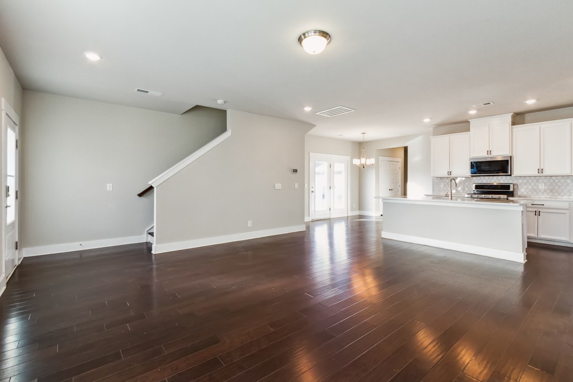 3261 Longstalk Road Antioch, TN 37013 - Photo 13 of 46 an empty room with wooden floor and windows
