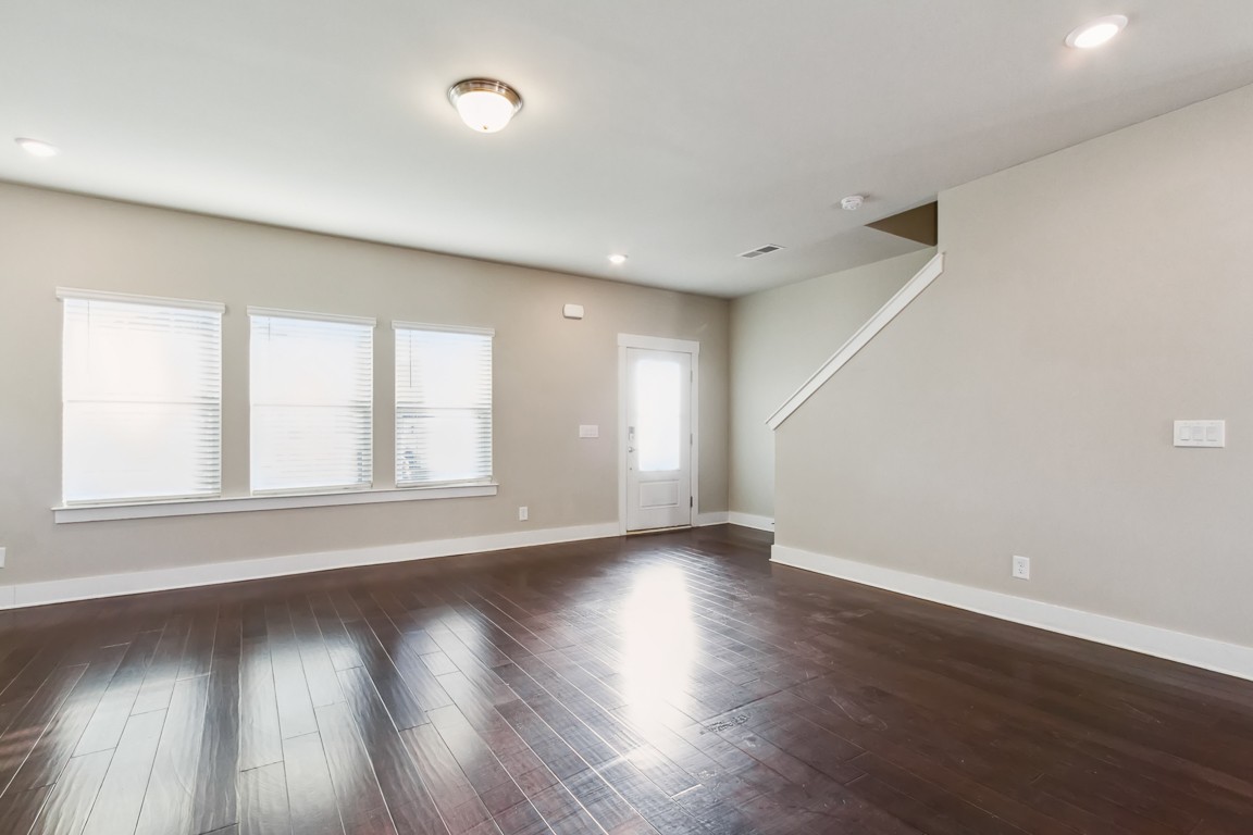 3261 Longstalk Road Antioch, TN 37013 - Photo 14 of 46 a view of an empty room with wooden floor and window
