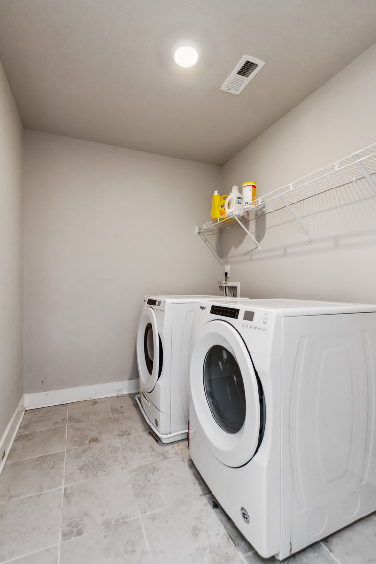 3261 Longstalk Road Antioch, TN 37013 - Photo 29 of 46 a utility room with dryer and washer