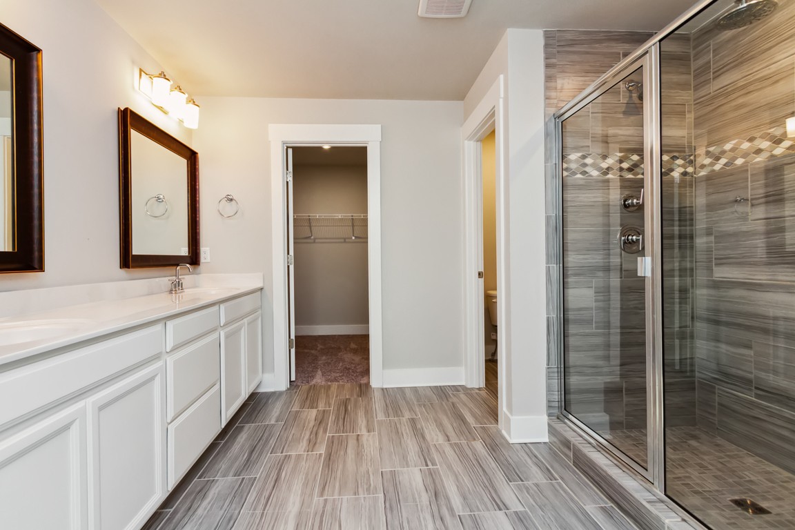 3261 Longstalk Road Antioch, TN 37013 - Photo 39 of 46 a bathroom with a sink a mirror and shower