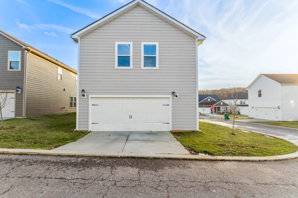 3261 Longstalk Road Antioch, TN 37013 - Photo 45 of 46 a view of a white house with a yard