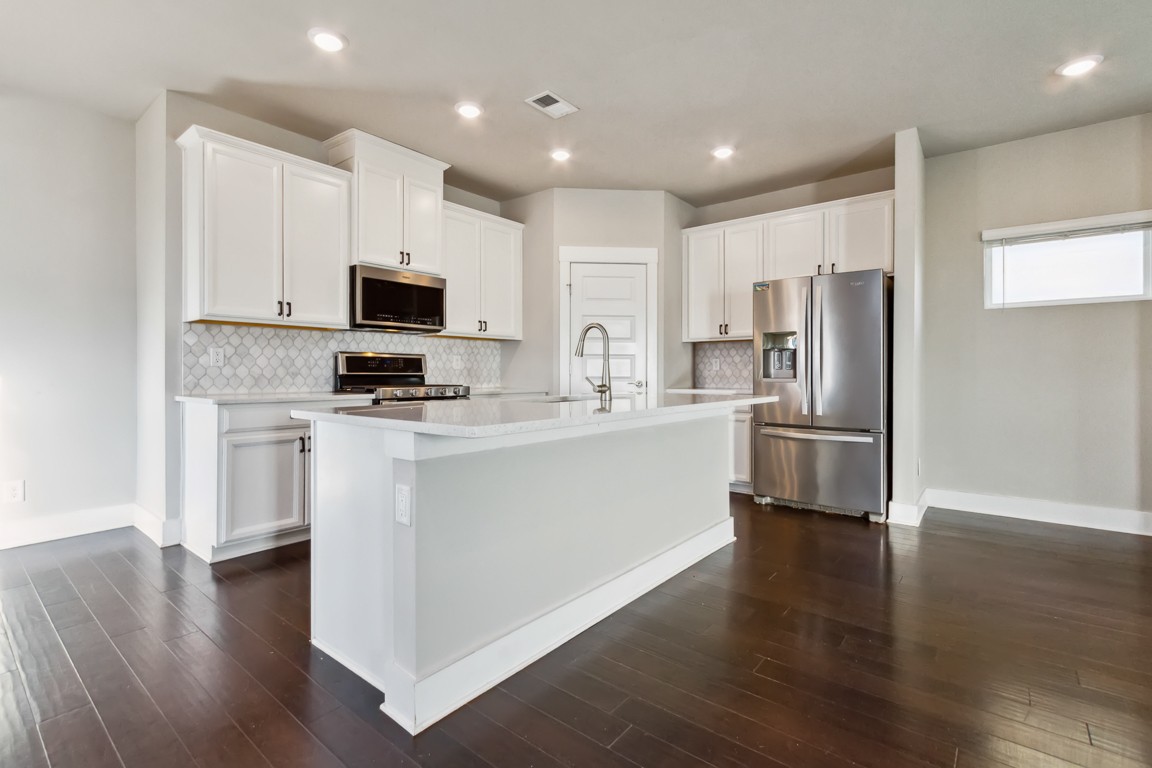 3261 Longstalk Road Antioch, TN 37013 - Photo 6 of 46 a kitchen with stainless steel appliances a refrigerator sink and microwave
