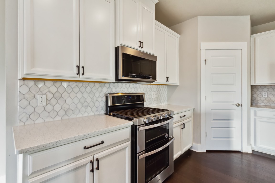 3261 Longstalk Road Antioch, TN 37013 - Photo 7 of 46 a kitchen with stainless steel appliances a stove microwave and refrigerator