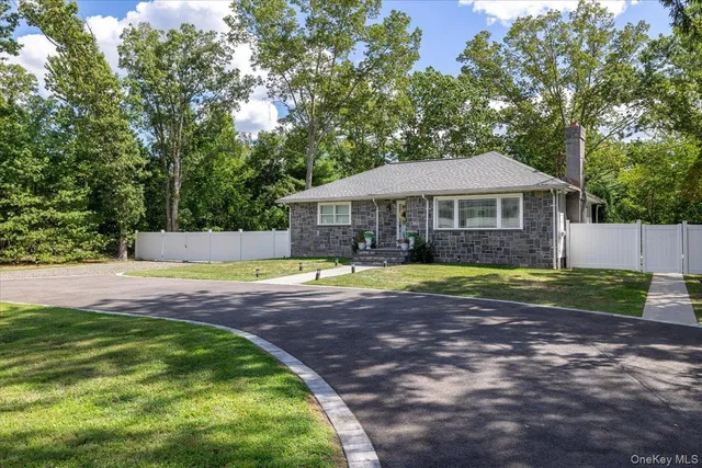 a view of a house with swimming pool and a yard