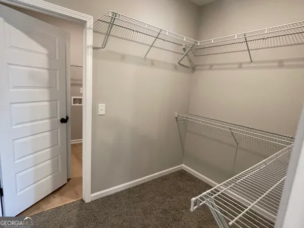 a view of a room with racks on the wall