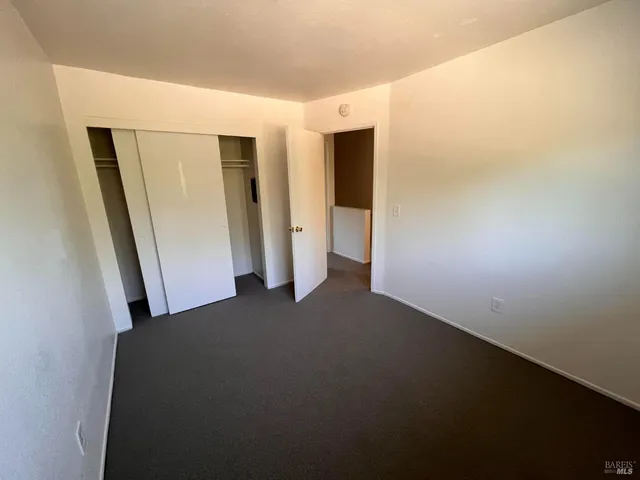 a view of empty room with closet