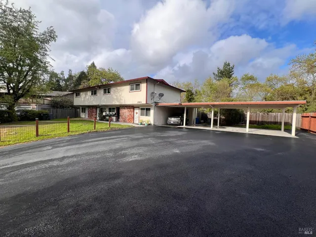 a view of a house with swimming pool and a yard
