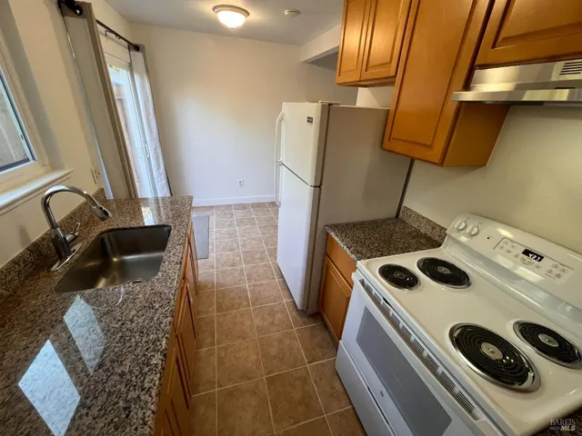 a bathroom with a sink and a washing machine