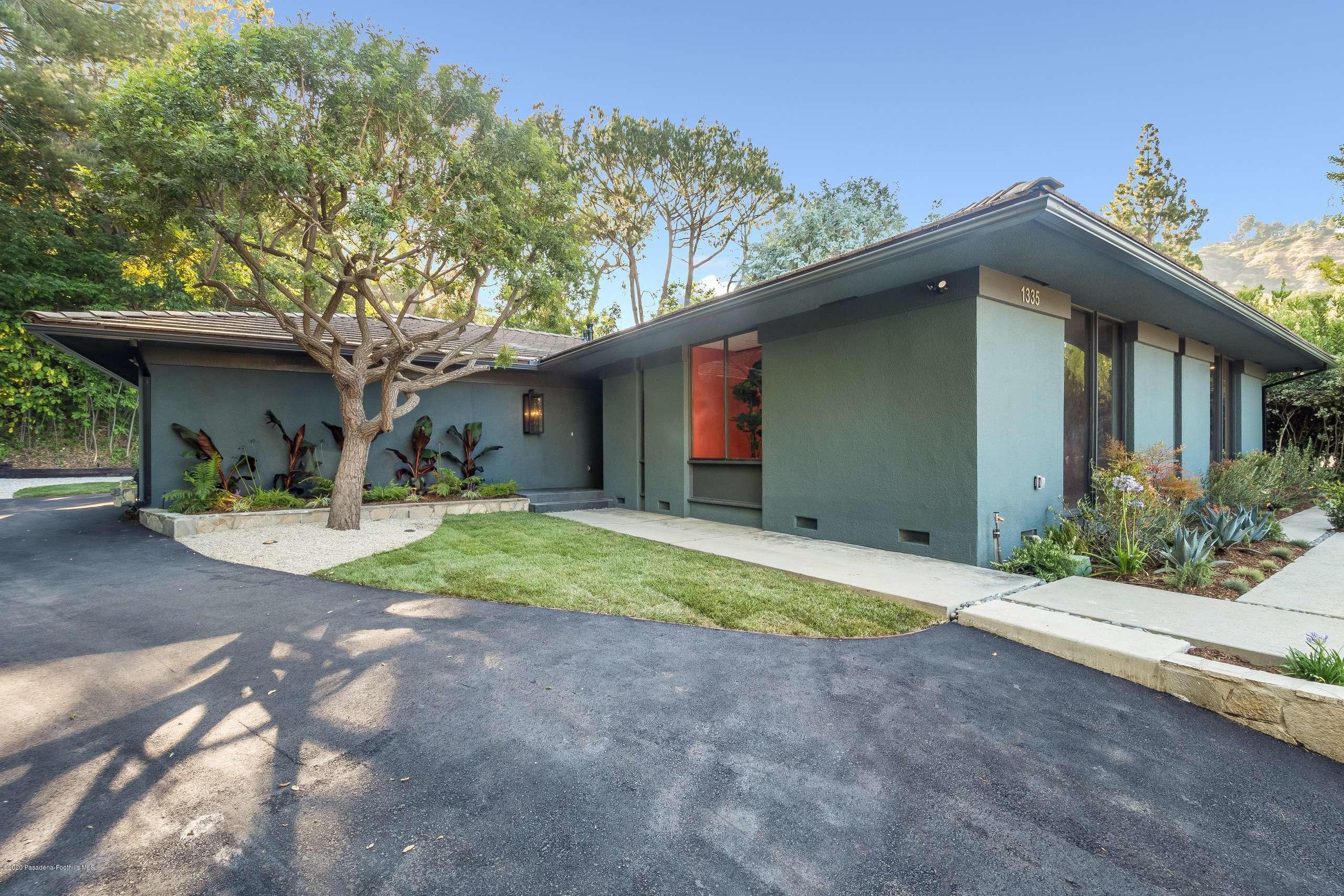 1335 Carnarvon Drive Pasadena, CA 91103 - Photo 2 of 52 a house with trees in front of it