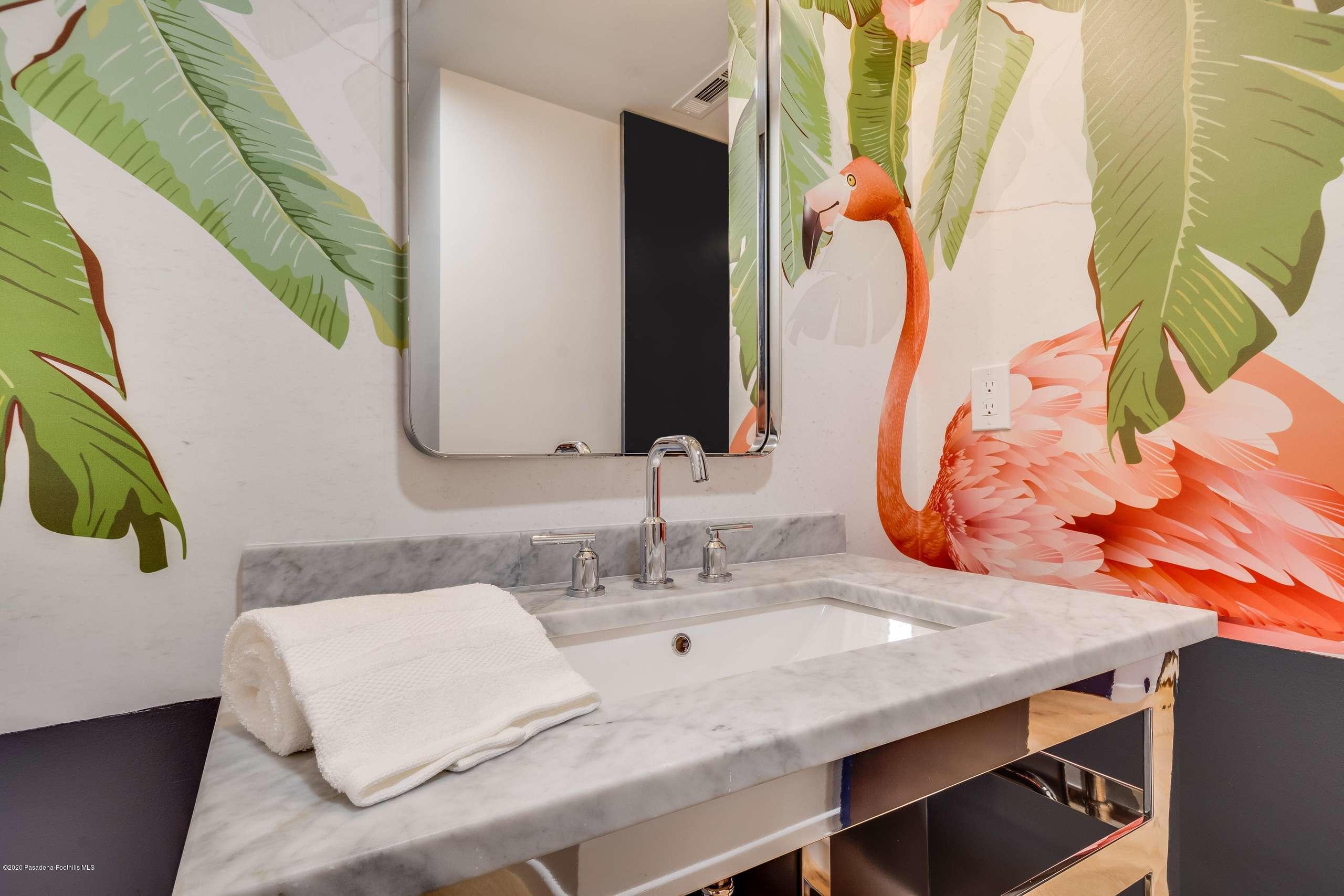 1335 Carnarvon Drive Pasadena, CA 91103 - Photo 14 of 52 a bathroom with a sink and a mirror