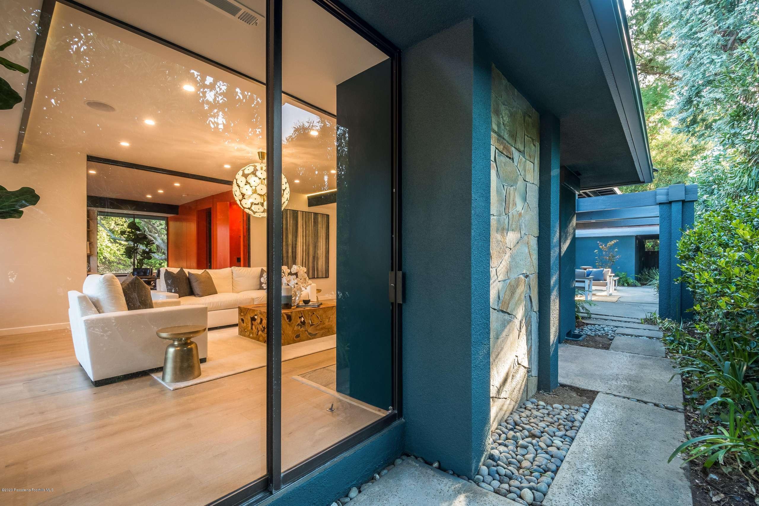 1335 Carnarvon Drive Pasadena, CA 91103 - Photo 15 of 52 a living room with furniture and a potted plant