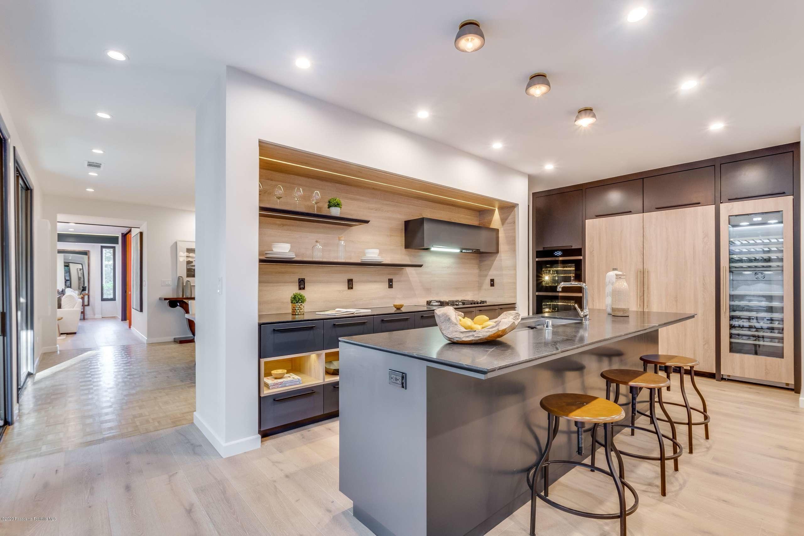 1335 Carnarvon Drive Pasadena, CA 91103 - Photo 17 of 52 a kitchen with stainless steel appliances granite countertop a sink and a refrigerator