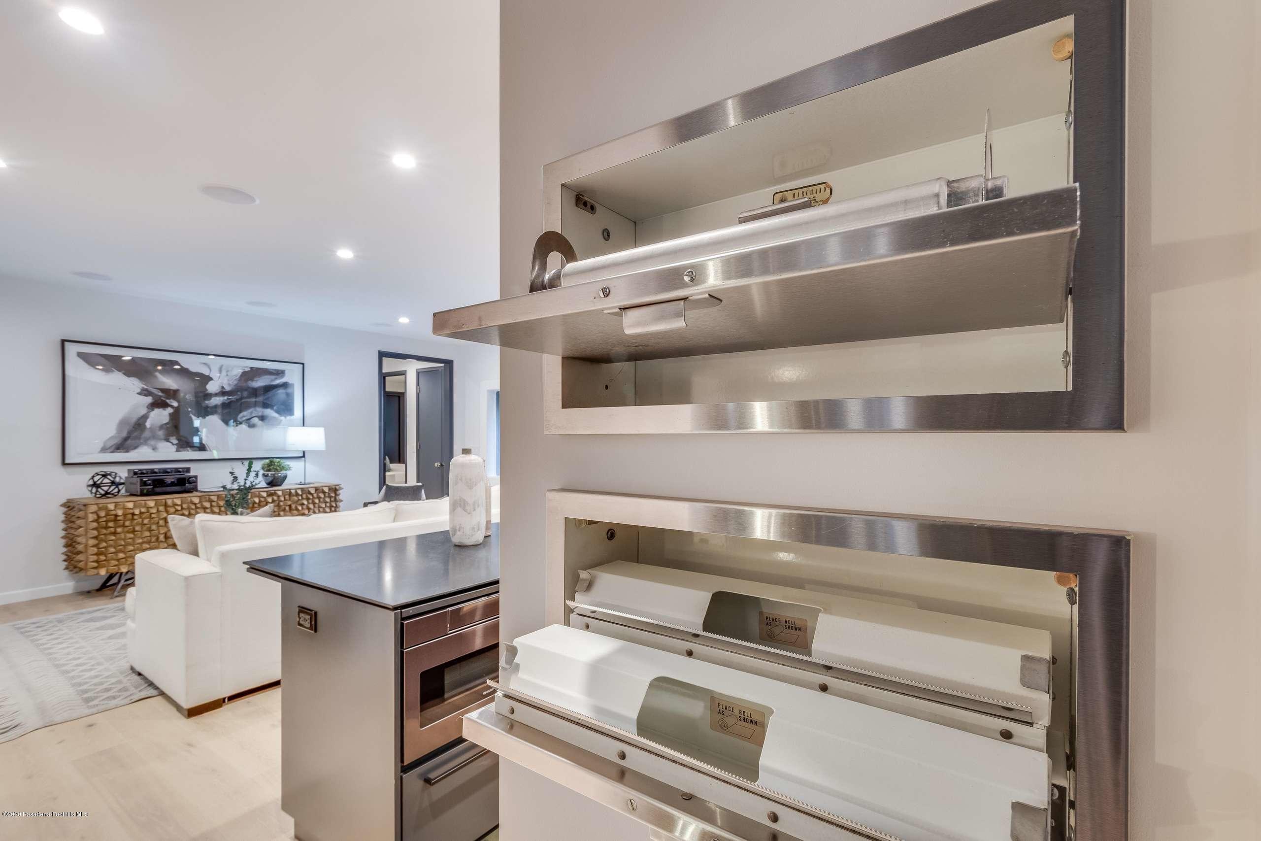 1335 Carnarvon Drive Pasadena, CA 91103 - Photo 23 of 52 a kitchen with a stove and a refrigerator