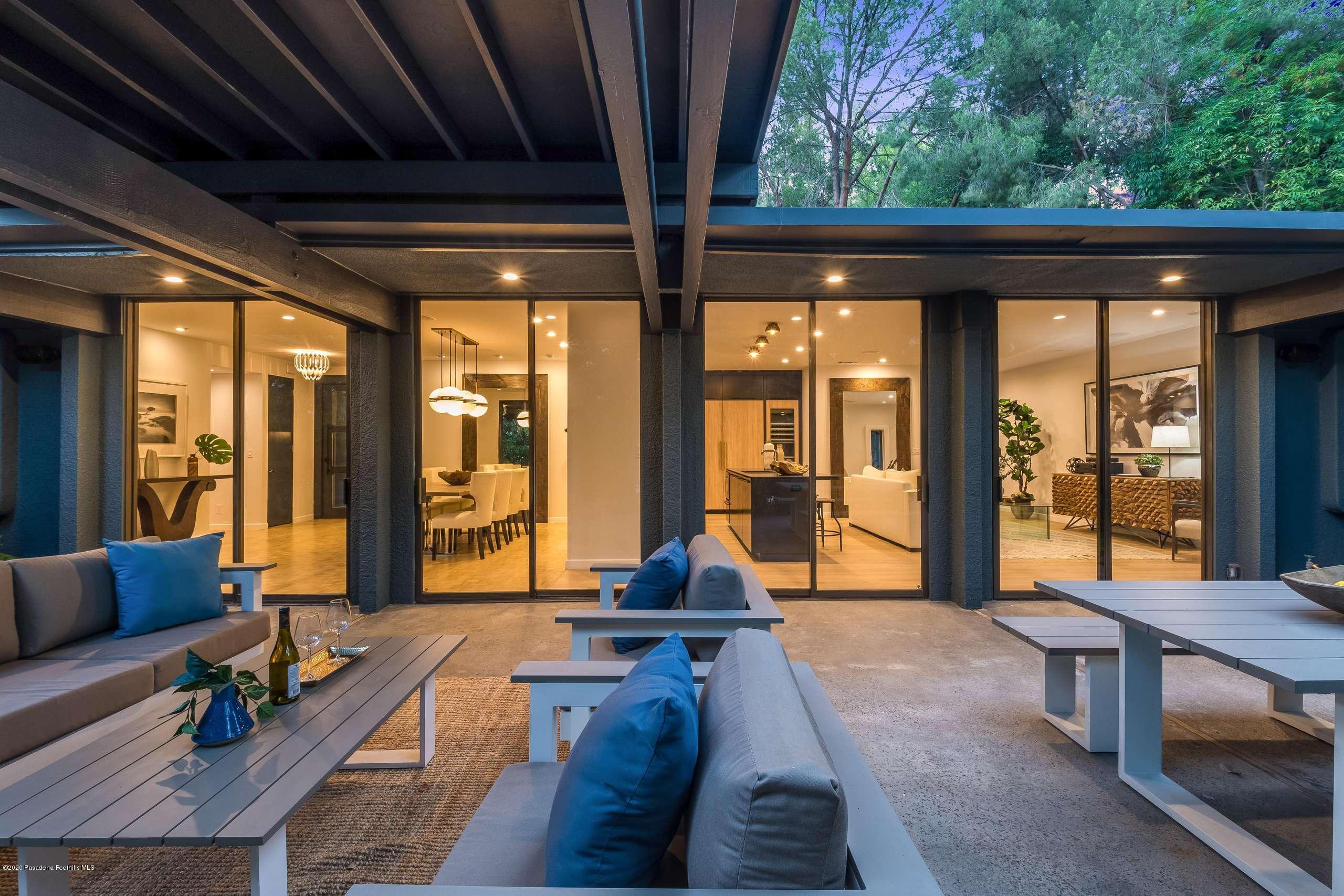 1335 Carnarvon Drive Pasadena, CA 91103 - Photo 27 of 52 a living room with furniture and large windows