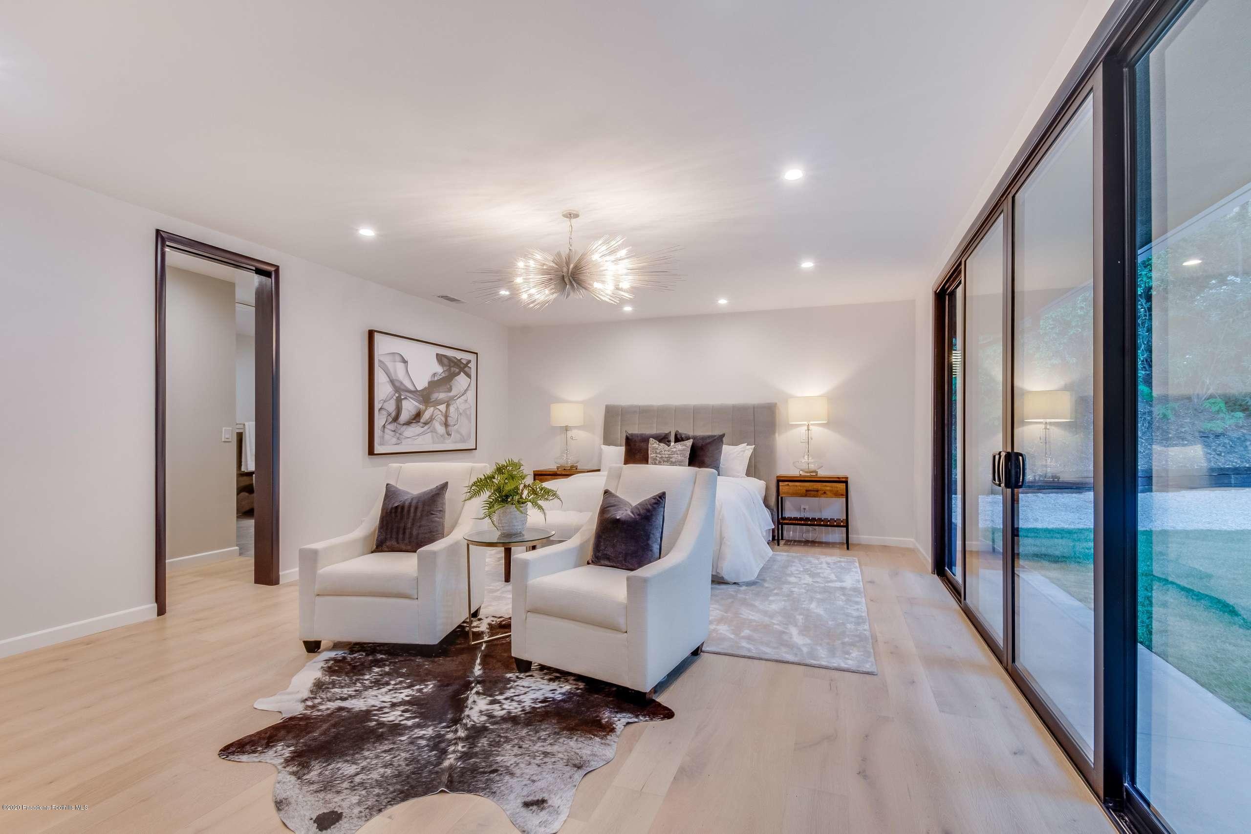 1335 Carnarvon Drive Pasadena, CA 91103 - Photo 28 of 52 a living room with furniture and a table