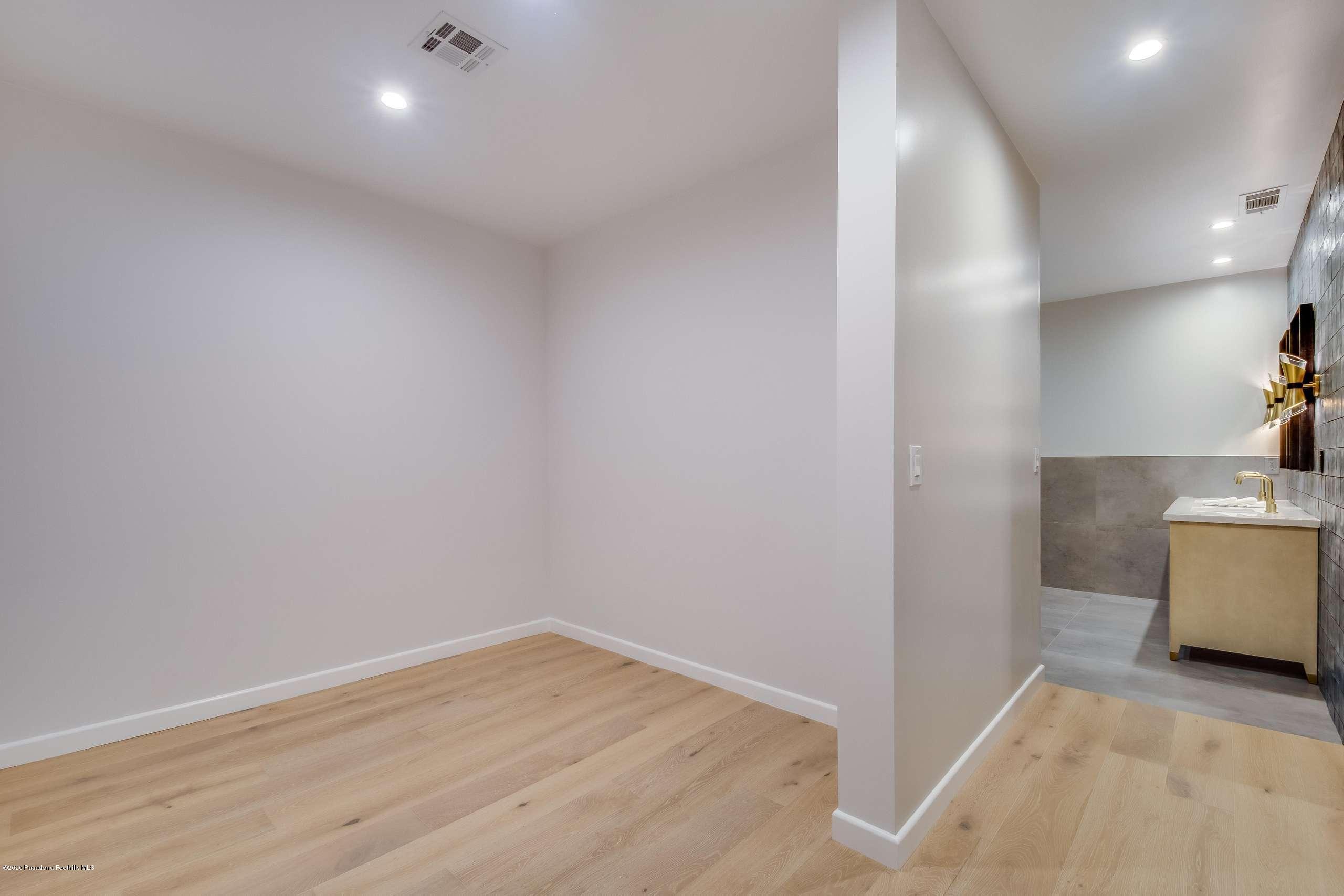 1335 Carnarvon Drive Pasadena, CA 91103 - Photo 32 of 52 a view of a room with wooden floor and a sink