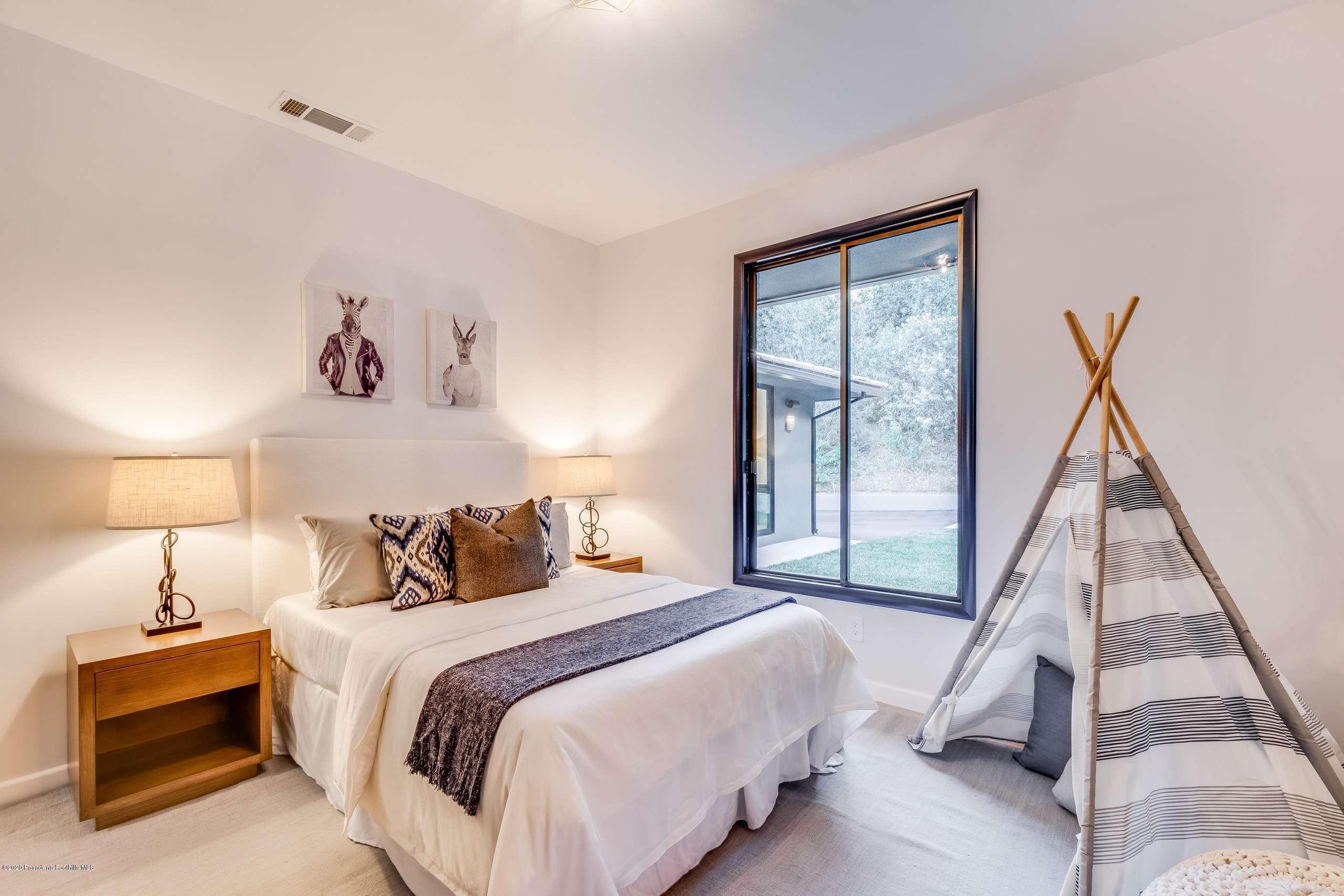 1335 Carnarvon Drive Pasadena, CA 91103 - Photo 33 of 52 a bedroom with a bed and a window