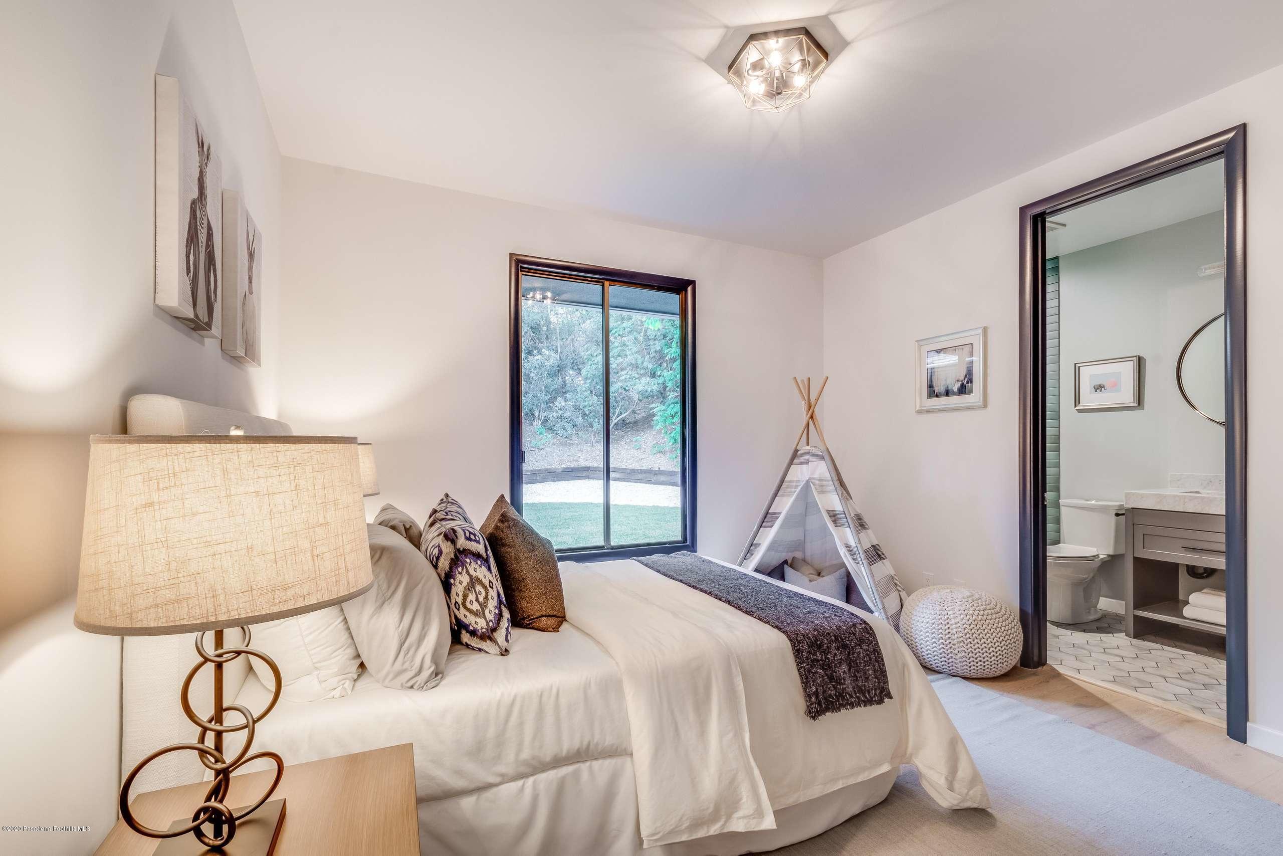 1335 Carnarvon Drive Pasadena, CA 91103 - Photo 34 of 52 a bedroom with a bed and balcony view