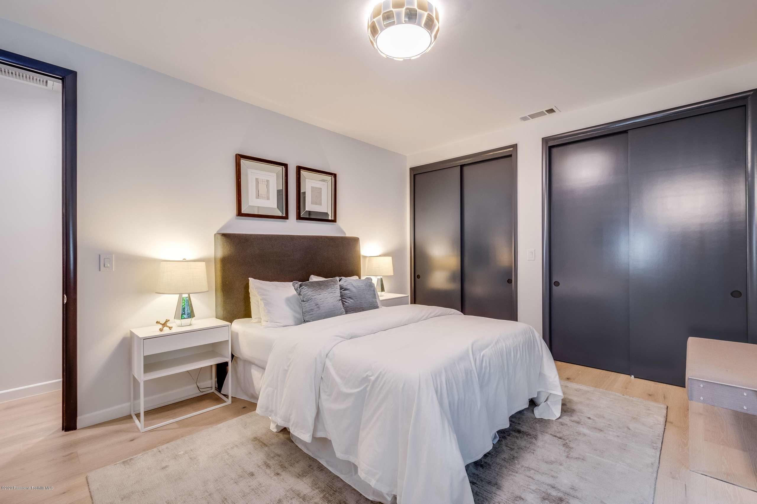 1335 Carnarvon Drive Pasadena, CA 91103 - Photo 36 of 52 a bedroom with a bed and a lamp