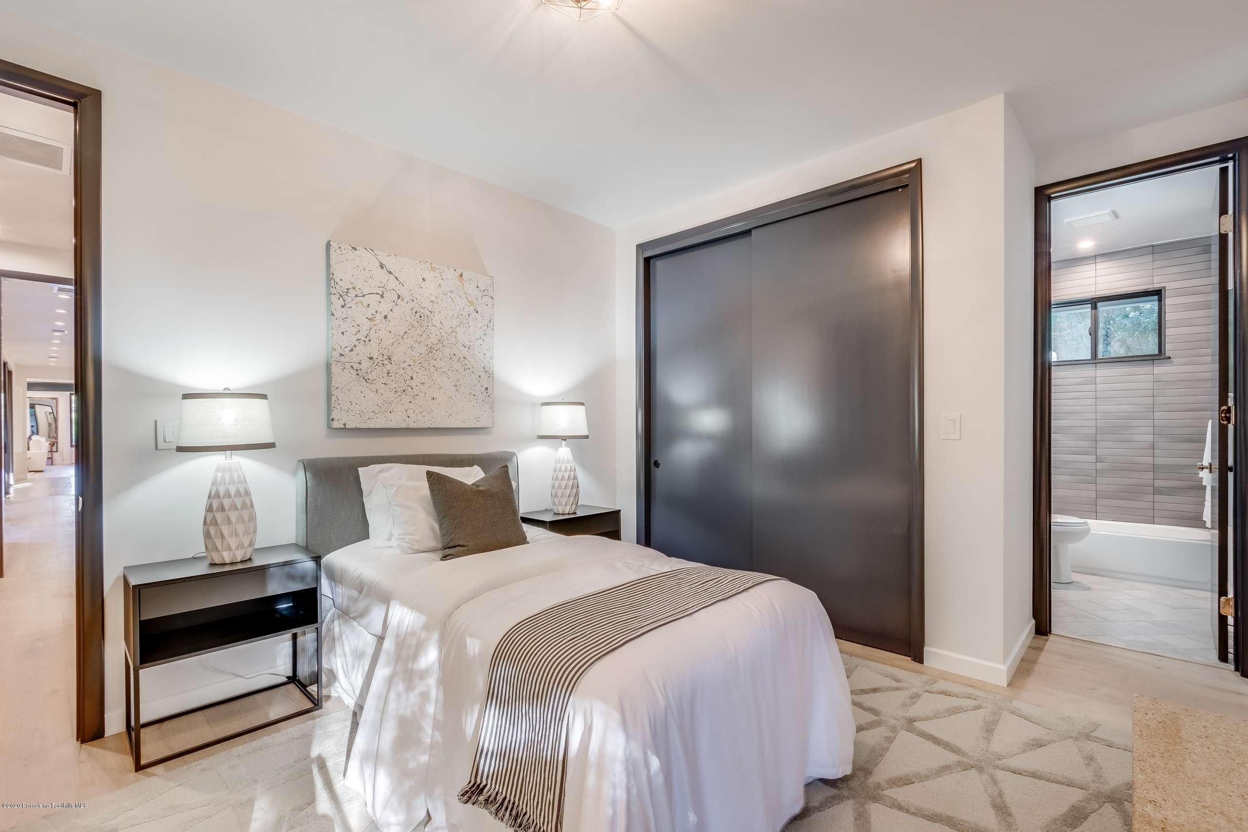 1335 Carnarvon Drive Pasadena, CA 91103 - Photo 40 of 52 a bedroom with a bed and a night stand