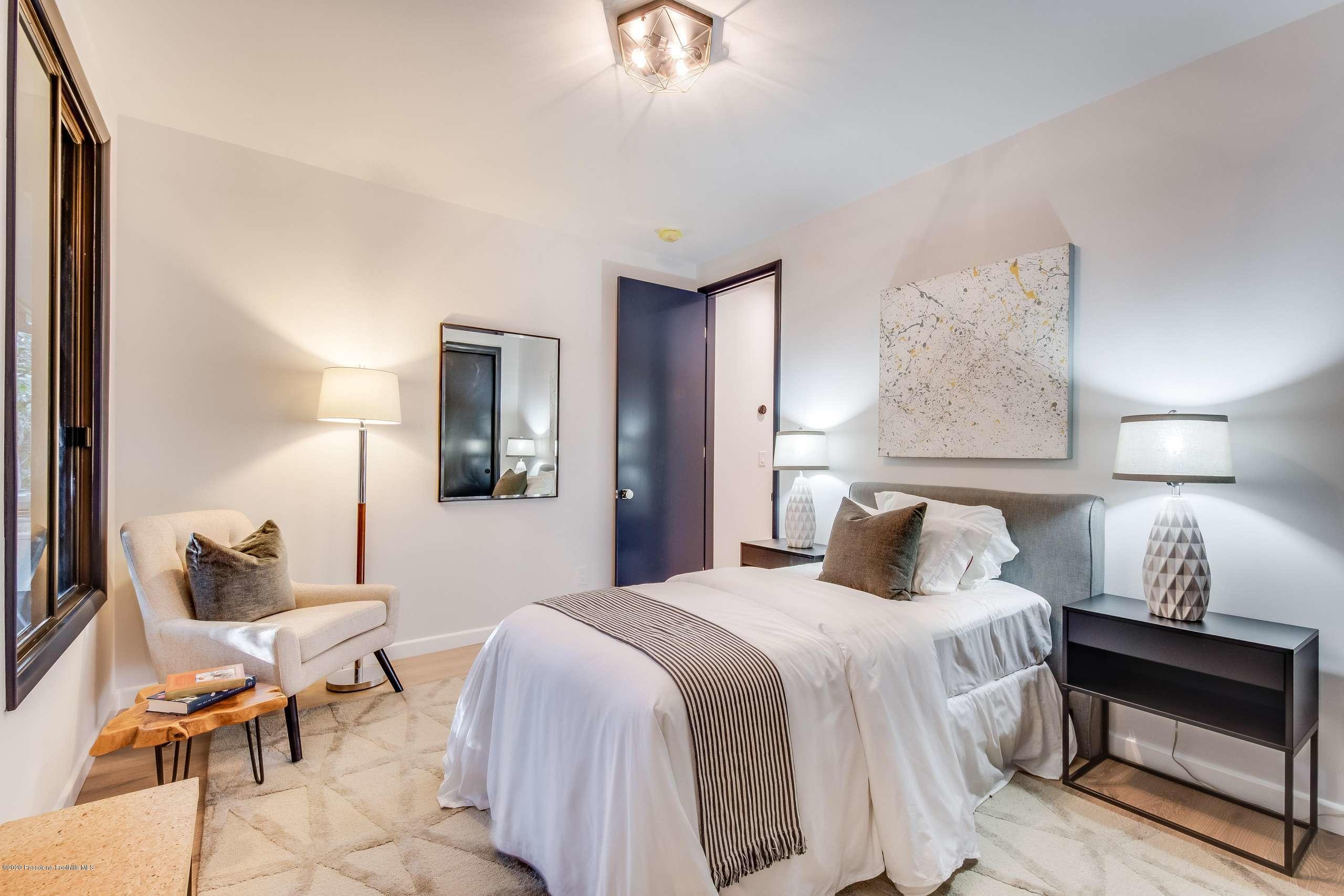 1335 Carnarvon Drive Pasadena, CA 91103 - Photo 41 of 52 a bedroom with a bed and lamp