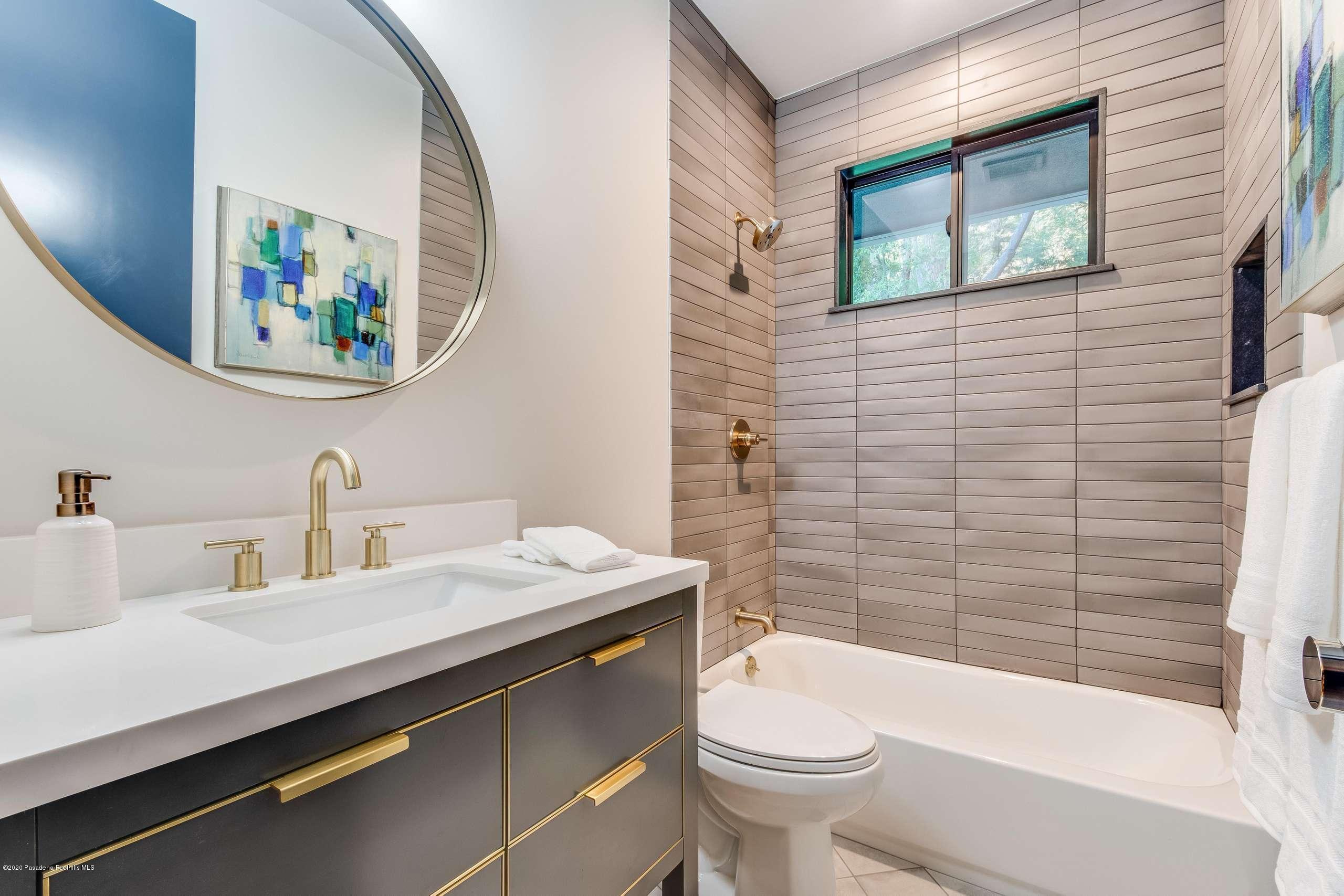 1335 Carnarvon Drive Pasadena, CA 91103 - Photo 42 of 52 a bathroom with a sink a toilet and a bathtub