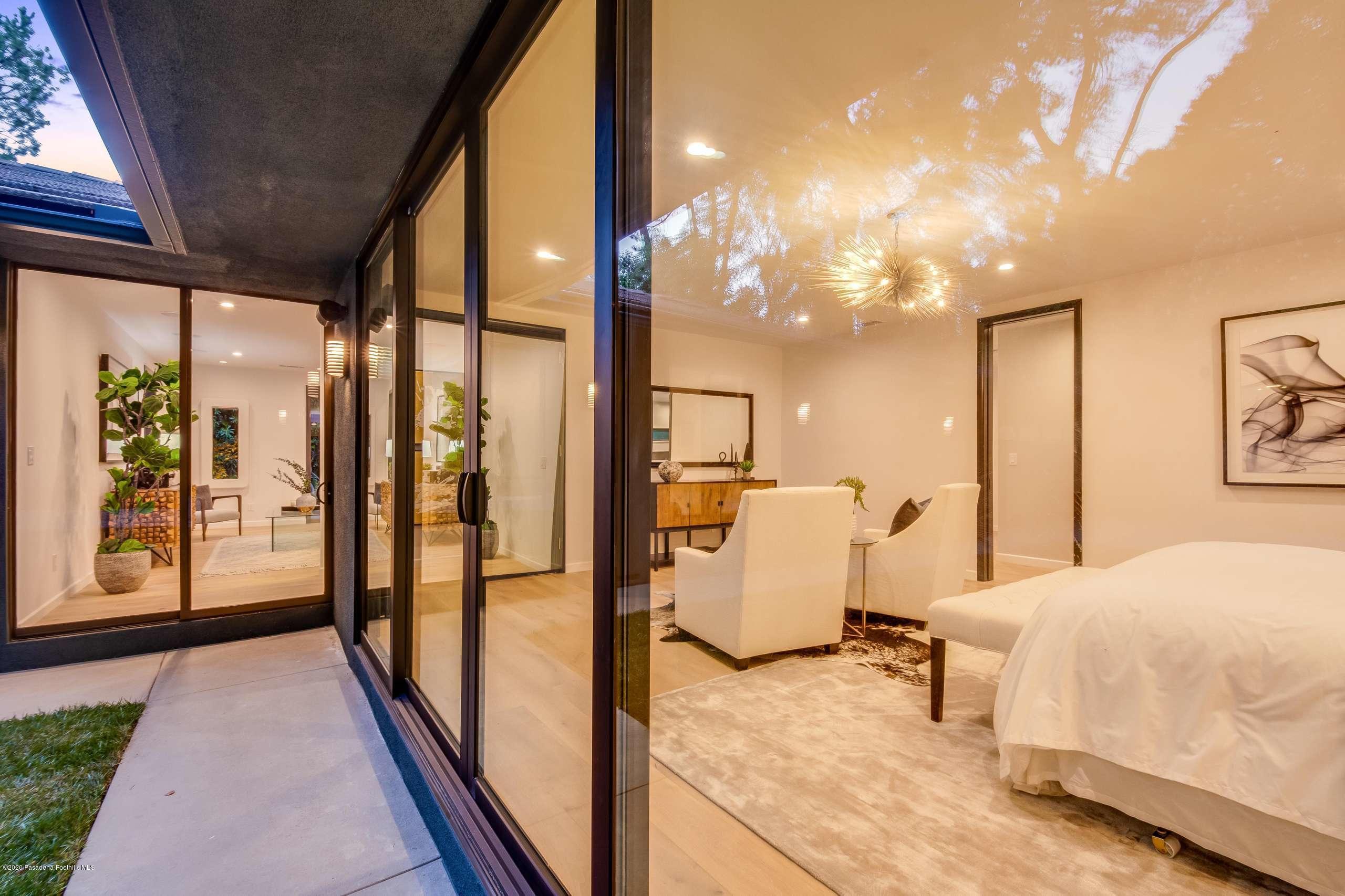 1335 Carnarvon Drive Pasadena, CA 91103 - Photo 46 of 52 a bedroom with a bed and large window with balcony view