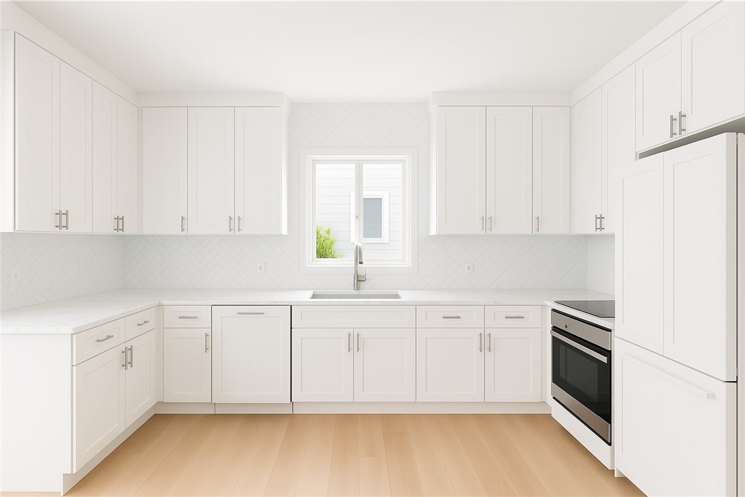18 Tarpon Drive Vero Beach, FL 32960 - Photo 17 of 36 a white kitchen with granite countertop white cabinets and white appliances