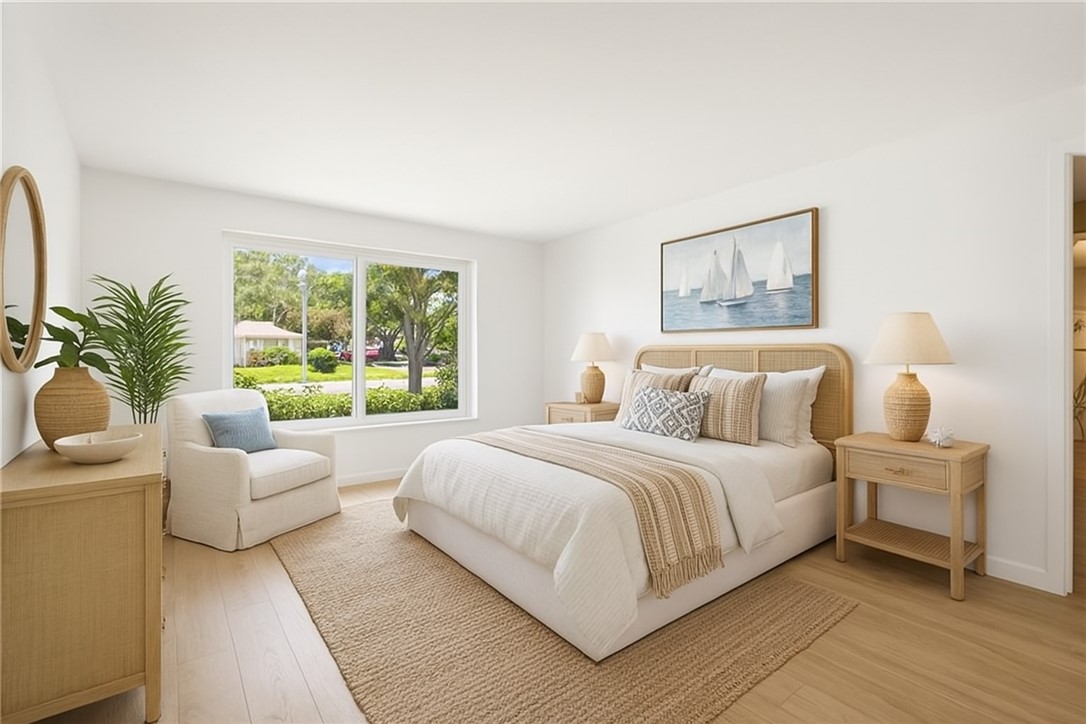 18 Tarpon Drive Vero Beach, FL 32960 - Photo 20 of 36 a bedroom with a large bed and a couch