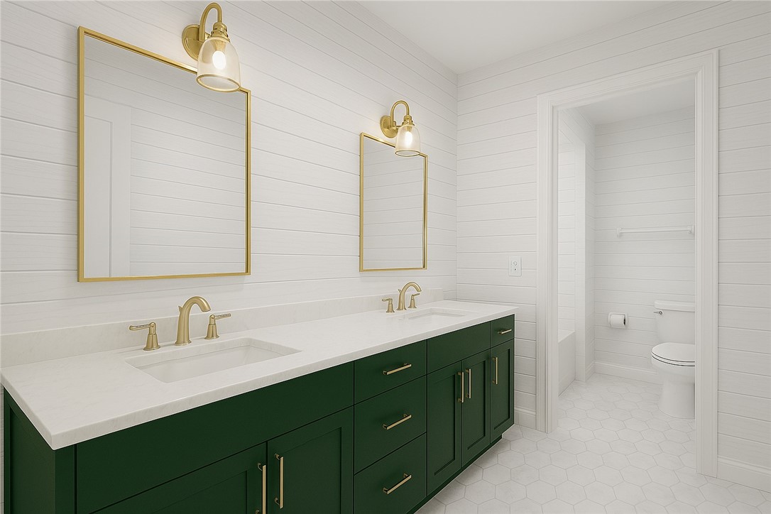 18 Tarpon Drive Vero Beach, FL 32960 - Photo 22 of 36 a bathroom with a double vanity sink toilet and mirror