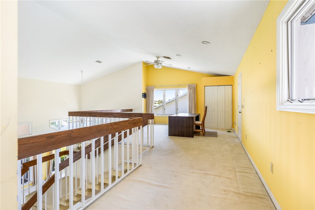 18 Tarpon Drive Vero Beach, FL 32960 - Photo 29 of 36 a view of a hallway with a dining table & chairs