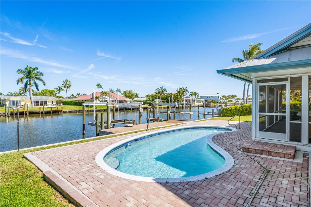 18 Tarpon Drive Vero Beach, FL 32960 - Photo 3 of 36 a view of a swimming pool with an outdoor seating