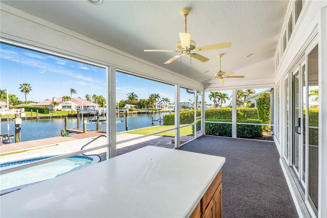 18 Tarpon Drive Vero Beach, FL 32960 - Photo 8 of 36 a view of a swimming pool with a patio and a yard