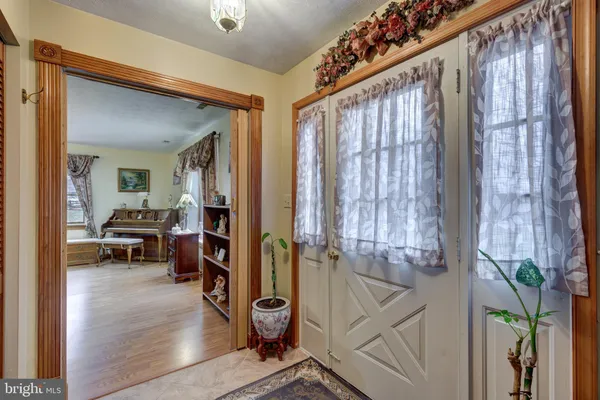 a view of front door with livingroom and furniture