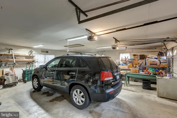 a view of a dinning table and chairs in patio of the house