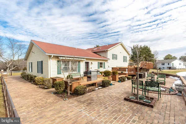 a view of a house with basketball court