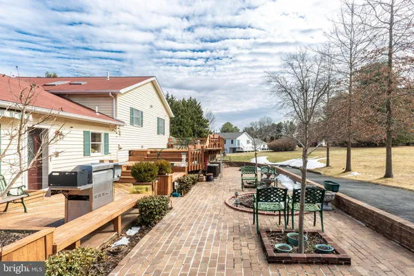 a view of a backyard with table and chairs