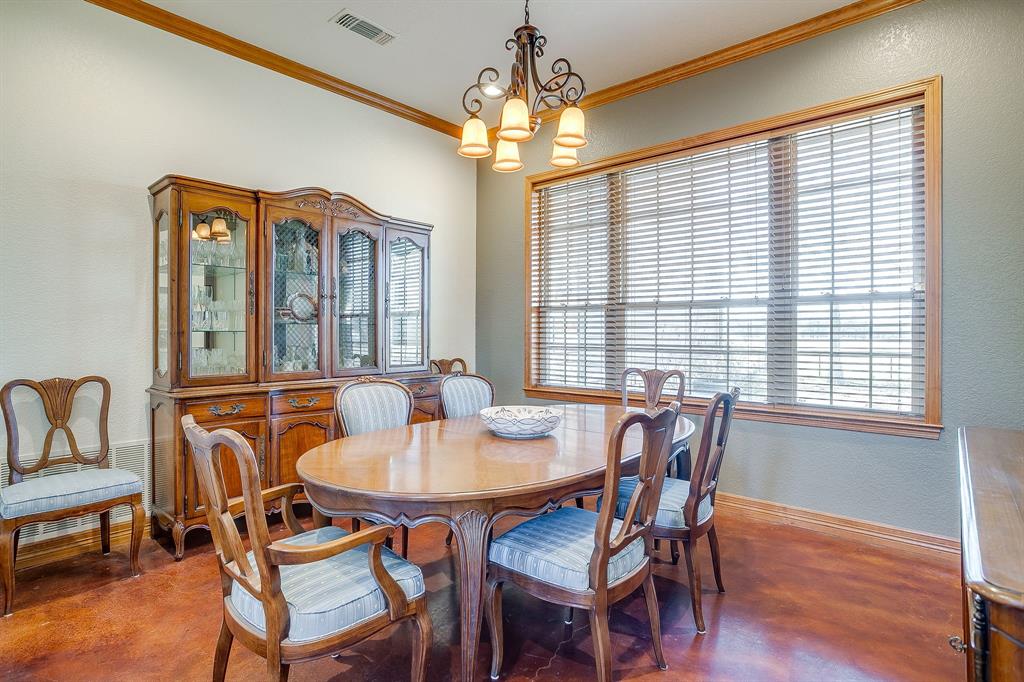 2608 Turkey Creek Road Mineral Wells, TX 76067 - Photo 13 of 39 a dining room with furniture a chandelier and wooden floor