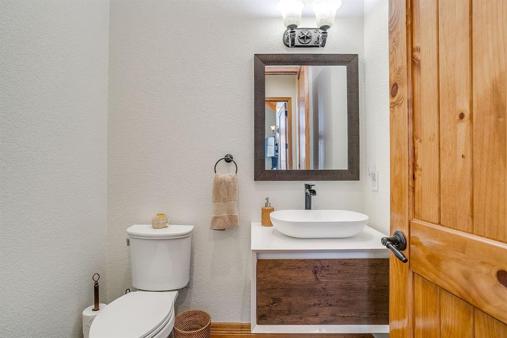 2608 Turkey Creek Road Mineral Wells, TX 76067 - Photo 14 of 39 a bathroom with a sink and a mirror