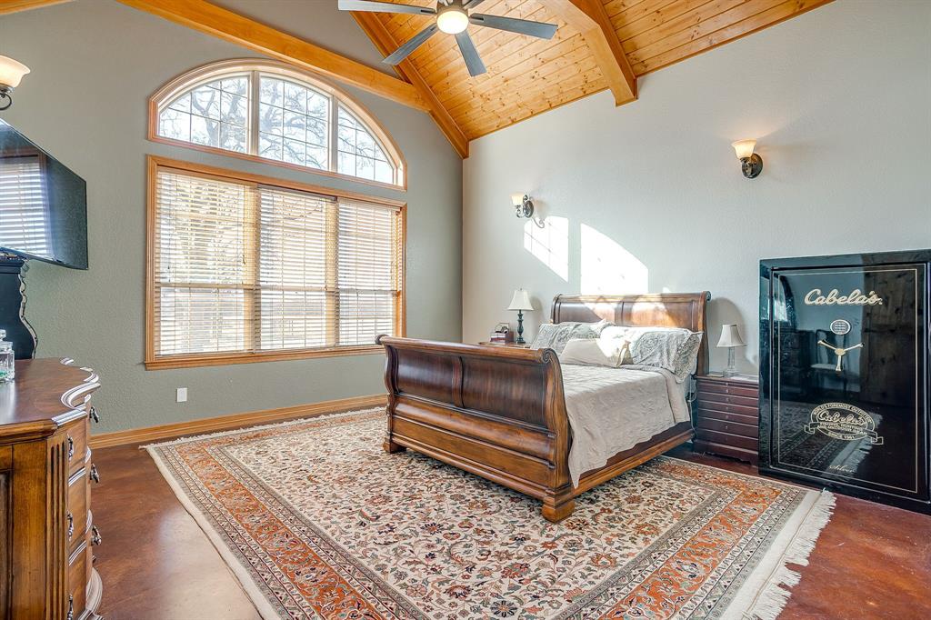 2608 Turkey Creek Road Mineral Wells, TX 76067 - Photo 15 of 39 a bedroom with a bed lamp closet and large window