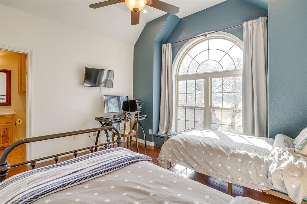2608 Turkey Creek Road Mineral Wells, TX 76067 - Photo 22 of 39 a bedroom with a bed and a large window