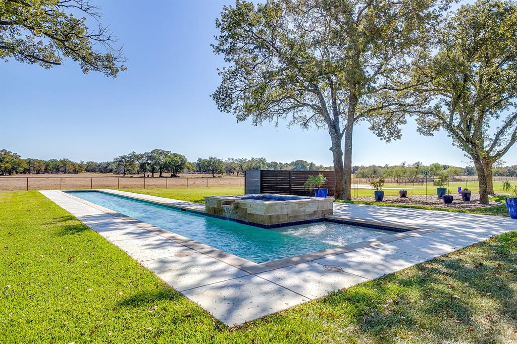 2608 Turkey Creek Road Mineral Wells, TX 76067 - Photo 32 of 39 a view of swimming pool with deck and a garden