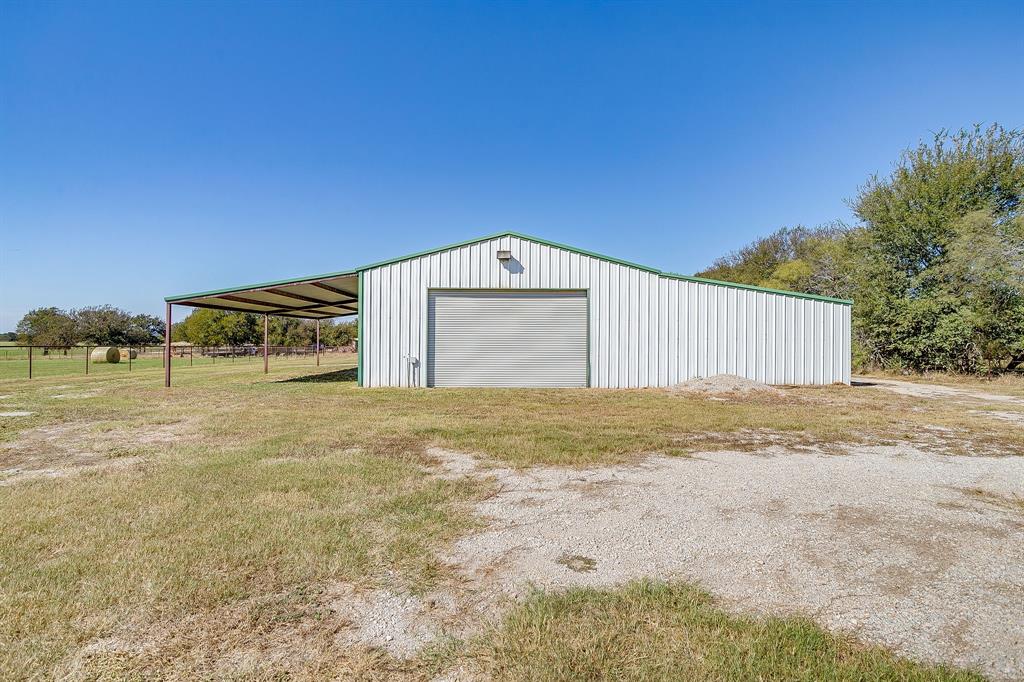2608 Turkey Creek Road Mineral Wells, TX 76067 - Photo 35 of 39 a front view of a house with a yard