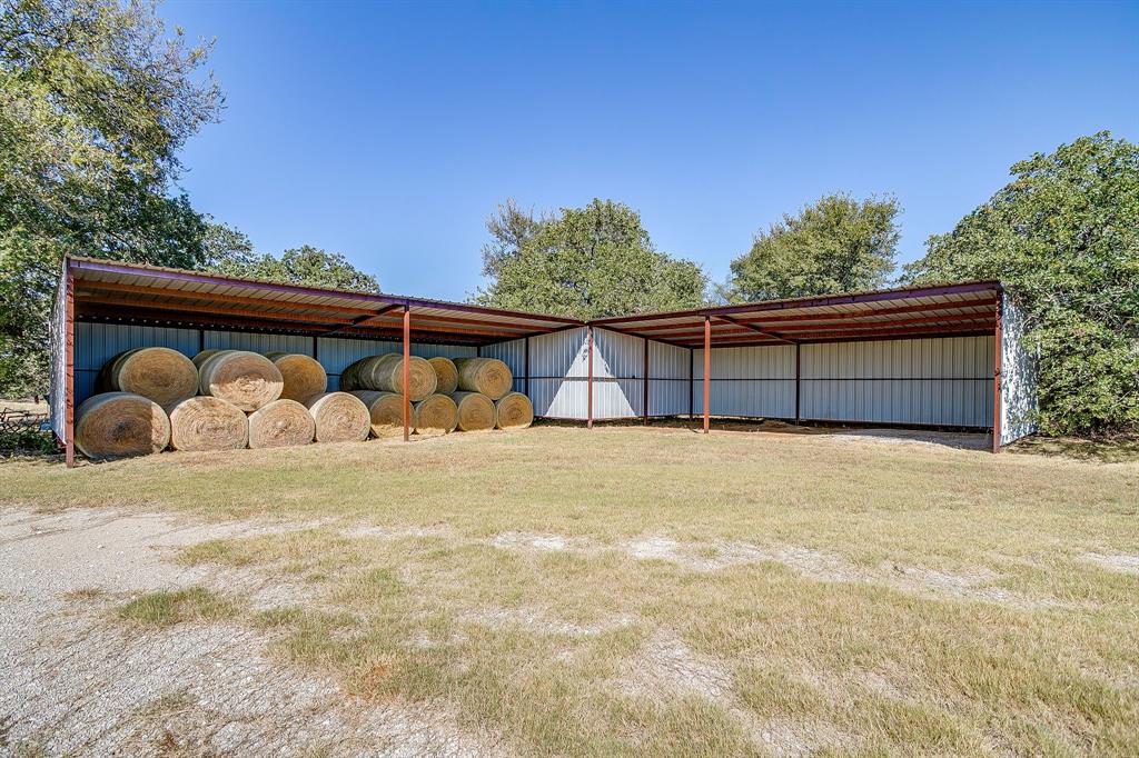 2608 Turkey Creek Road Mineral Wells, TX 76067 - Photo 37 of 39 a front view of a house with a yard and garage