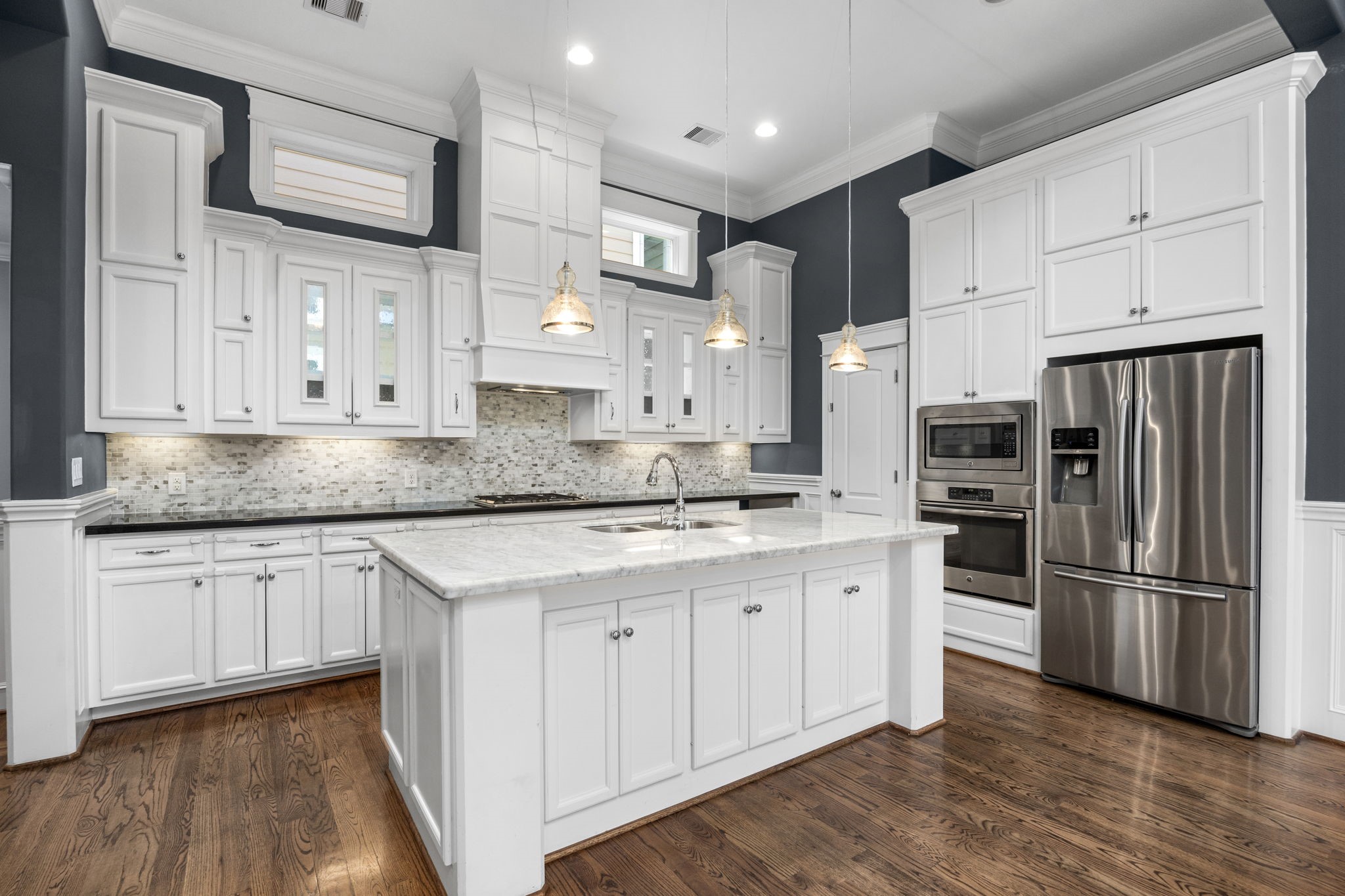619 Rutland Street, Unit B Houston, TX 77007 - Photo 14 of 33 a kitchen with stainless steel appliances granite countertop a stove a sink and a refrigerator