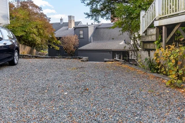 a view of a house with a yard and sitting area