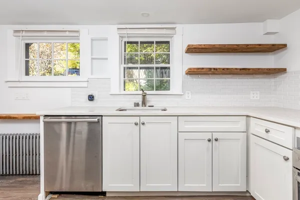 a kitchen with a sink and cabinets