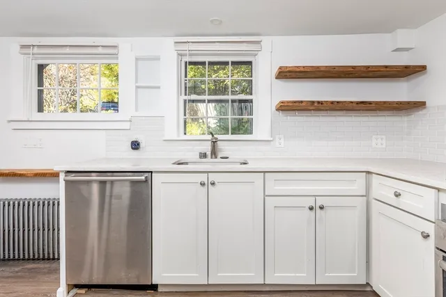 a kitchen with a sink and cabinets